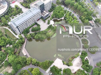 A lake shaped like a map of China is being seen at a university in Hangzhou, Zhejiang province, China, on June 14, 2024. (