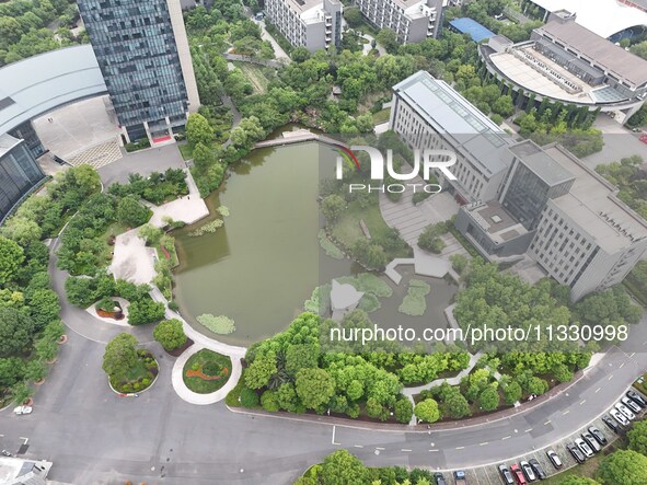 A lake shaped like a map of China is being seen at a university in Hangzhou, Zhejiang province, China, on June 14, 2024. 