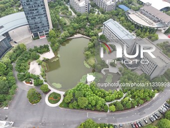 A lake shaped like a map of China is being seen at a university in Hangzhou, Zhejiang province, China, on June 14, 2024. (