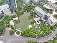 A lake shaped like a map of China is being seen at a university in Hangzhou, Zhejiang province, China, on June 14, 2024. (