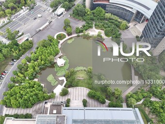 A lake shaped like a map of China is being seen at a university in Hangzhou, Zhejiang province, China, on June 14, 2024. (