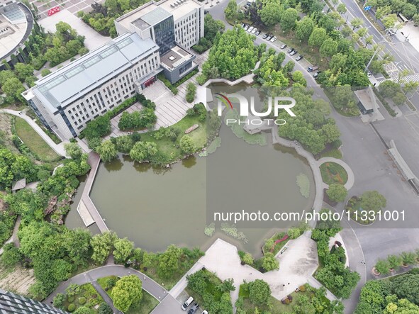 A lake shaped like a map of China is being seen at a university in Hangzhou, Zhejiang province, China, on June 14, 2024. 