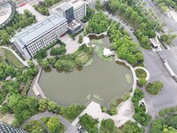 A lake shaped like a map of China is being seen at a university in Hangzhou, Zhejiang province, China, on June 14, 2024. (