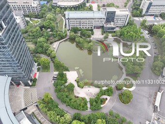 A lake shaped like a map of China is being seen at a university in Hangzhou, Zhejiang province, China, on June 14, 2024. (