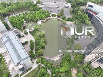 A lake shaped like a map of China is being seen at a university in Hangzhou, Zhejiang province, China, on June 14, 2024. (