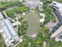 A lake shaped like a map of China is being seen at a university in Hangzhou, Zhejiang province, China, on June 14, 2024. (