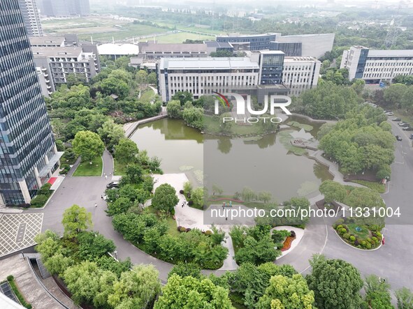 A lake shaped like a map of China is being seen at a university in Hangzhou, Zhejiang province, China, on June 14, 2024. 