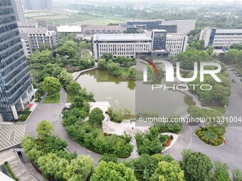 A lake shaped like a map of China is being seen at a university in Hangzhou, Zhejiang province, China, on June 14, 2024. (