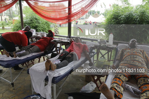 Volunteers are donating blood during the Lagos State Blood Transfusion Committee's awareness walk to mark 2024 World Blood Donor Day at JJT...