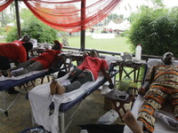 Volunteers are donating blood during the Lagos State Blood Transfusion Committee's awareness walk to mark 2024 World Blood Donor Day at JJT...