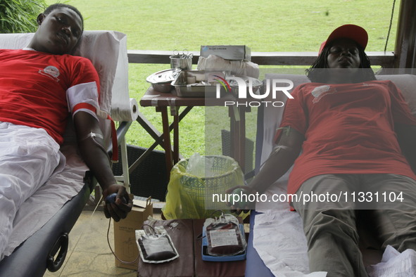 Volunteers are donating blood during the Lagos State Blood Transfusion Committee's awareness walk to mark 2024 World Blood Donor Day at JJT...