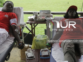 Volunteers are donating blood during the Lagos State Blood Transfusion Committee's awareness walk to mark 2024 World Blood Donor Day at JJT...