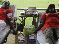 Volunteers are donating blood during the Lagos State Blood Transfusion Committee's awareness walk to mark 2024 World Blood Donor Day at JJT...