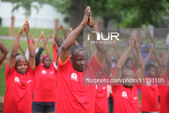 Members of the Red Cross are warming up before joining Lagos State Blood Transfusion Committee's awareness walk to mark 2024 World Blood Don...