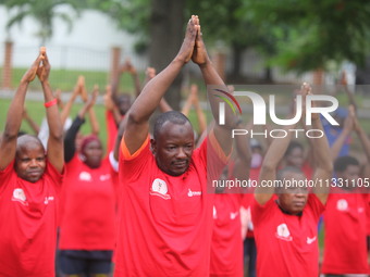 Members of the Red Cross are warming up before joining Lagos State Blood Transfusion Committee's awareness walk to mark 2024 World Blood Don...