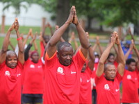 Members of the Red Cross are warming up before joining Lagos State Blood Transfusion Committee's awareness walk to mark 2024 World Blood Don...