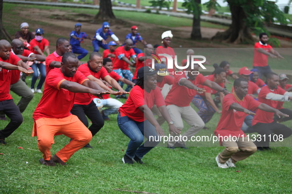 Members of the Red Cross are warming up before joining Lagos State Blood Transfusion Committee's awareness walk to mark 2024 World Blood Don...