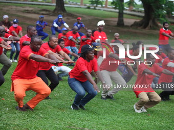 Members of the Red Cross are warming up before joining Lagos State Blood Transfusion Committee's awareness walk to mark 2024 World Blood Don...