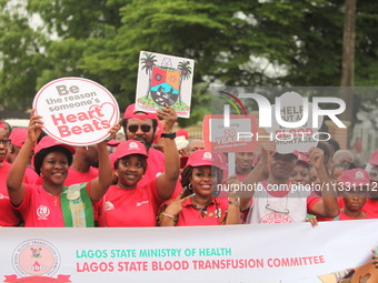 Members of the Lagos State Blood Transfusion Committee and others are participating in the committee's awareness walk to mark 2024 World Blo...