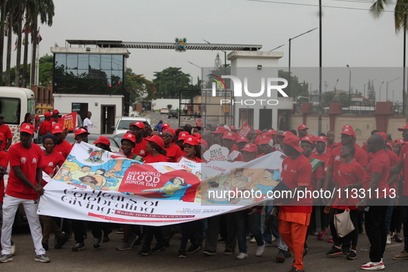 Members of the Lagos State Blood Transfusion Committee and others are participating in the committee's awareness walk to mark 2024 World Blo...