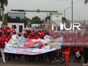 Members of the Lagos State Blood Transfusion Committee and others are participating in the committee's awareness walk to mark 2024 World Blo...