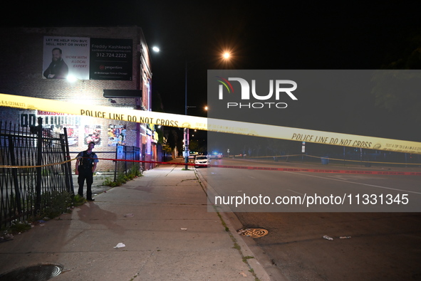 An unidentified male is being wounded after being shot while standing on the street in Chicago, Illinois, United States, on June 14, 2024. A...