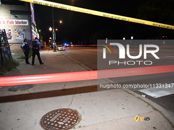 An unidentified male is being wounded after being shot while standing on the street in Chicago, Illinois, United States, on June 14, 2024. A...