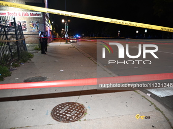 An unidentified male is being wounded after being shot while standing on the street in Chicago, Illinois, United States, on June 14, 2024. A...