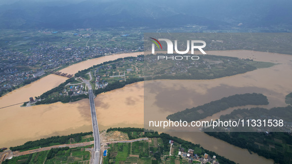 The water level in the Rongan county section of the Pearl River is rising and becoming turbid after a rainstorm in Liuzhou, China, on June 1...