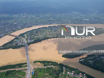 The water level in the Rongan county section of the Pearl River is rising and becoming turbid after a rainstorm in Liuzhou, China, on June 1...