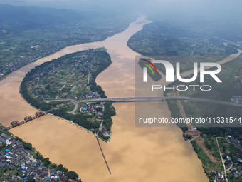 The water level in the Rongan county section of the Pearl River is rising and becoming turbid after a rainstorm in Liuzhou, China, on June 1...