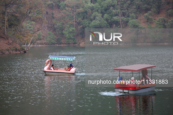 People are boating along Sattal Lake in Sattal (Sat Tal), Uttarakhand, India, on April 20, 2024. 