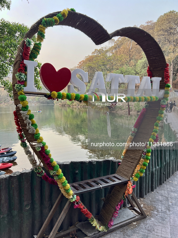 A heart-shaped selfie spot is appearing along Sattal Lake in Sattal (Sat Tal), Uttarakhand, India, on April 20, 2024. 