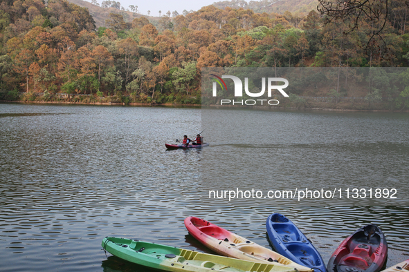 People are kayaking along Sattal Lake in Sattal (Sat Tal), Uttarakhand, India, on April 20, 2024. 