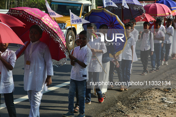 Youth from Saint George Orthodox Church are taking part in a procession in Kalathoor, Kerala, India, on April 05, 2024. 