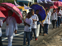 Youth from Saint George Orthodox Church are taking part in a procession in Kalathoor, Kerala, India, on April 05, 2024. (