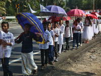 Youth from Saint George Orthodox Church are taking part in a procession in Kalathoor, Kerala, India, on April 05, 2024. (