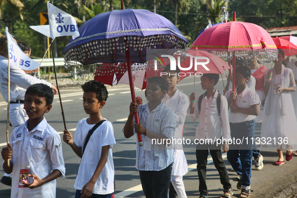 Youth from Saint George Orthodox Church are taking part in a procession in Kalathoor, Kerala, India, on April 05, 2024. 