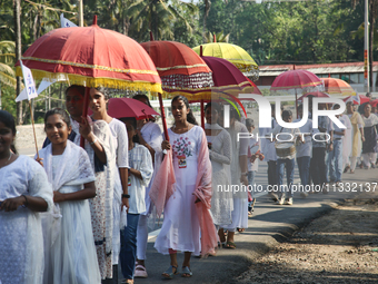 Youth from Saint George Orthodox Church are taking part in a procession in Kalathoor, Kerala, India, on April 05, 2024. (