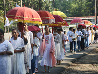 Youth from Saint George Orthodox Church are taking part in a procession in Kalathoor, Kerala, India, on April 05, 2024. (