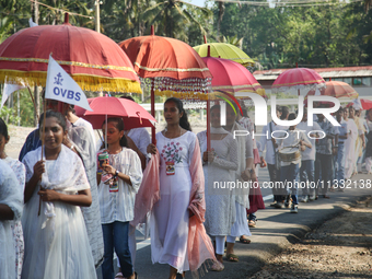 Youth from Saint George Orthodox Church are taking part in a procession in Kalathoor, Kerala, India, on April 05, 2024. (