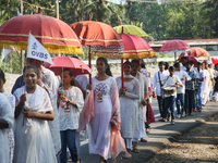 Youth from Saint George Orthodox Church are taking part in a procession in Kalathoor, Kerala, India, on April 05, 2024. (