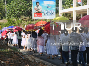 Youth from Saint George Orthodox Church are taking part in a procession in Kalathoor, Kerala, India, on April 05, 2024. (