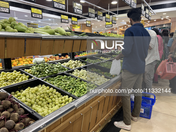 Shoppers are purchasing groceries at the Pothy's market in Thiruvananthapuram (Trivandrum), Kerala, India, on April 08, 2024. Inflation in I...