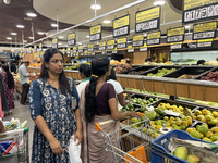 Shoppers are purchasing groceries at the Pothy's market in Thiruvananthapuram (Trivandrum), Kerala, India, on April 08, 2024. Inflation in I...