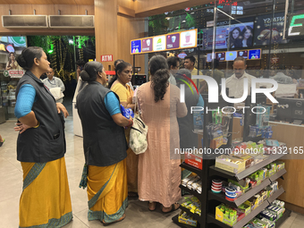 Women are purchasing groceries at the Pothy's market in Thiruvananthapuram (Trivandrum), Kerala, India, on April 08, 2024. (