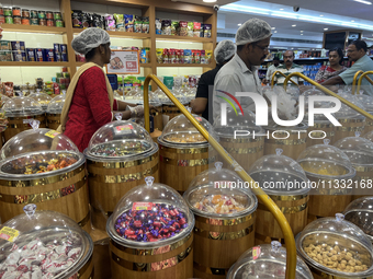 Shoppers are purchasing sweets and candies at the Pothy's market in Thiruvananthapuram (Trivandrum), Kerala, India, on April 08, 2024. Infla...