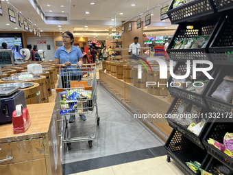 Shoppers are purchasing groceries at the Pothy's market in Thiruvananthapuram (Trivandrum), Kerala, India, on April 08, 2024. (