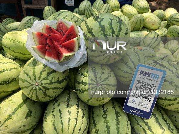 Watermelons are being sold along the roadside in Thiruvananthapuram (Trivandrum), Kerala, India, on April 10, 2024. 