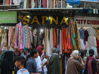 People are shopping at a market ahead of the Eid al-Adha festival in Srinagar, India, on June 15, 2024. Eid al-Adha is the holiest of the tw...